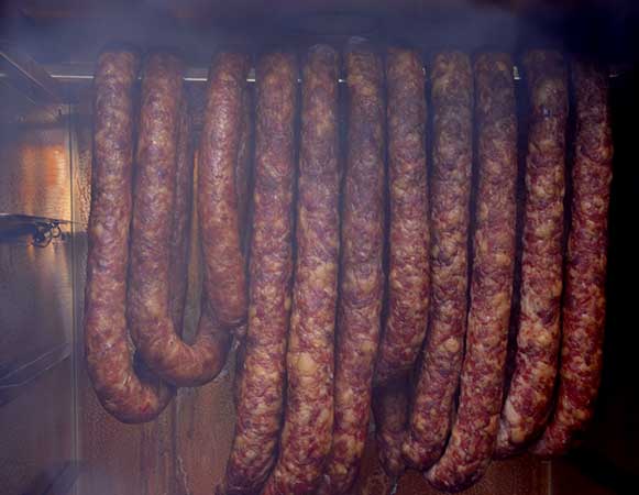 https://smokehouse.guru/wp-content/uploads/2023/Borniak/how-to-make-smoked-sausage-electric-smoker.jpg